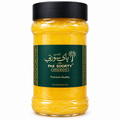 Pak Soorty Premium Desi Cow Ghee in transparent jar