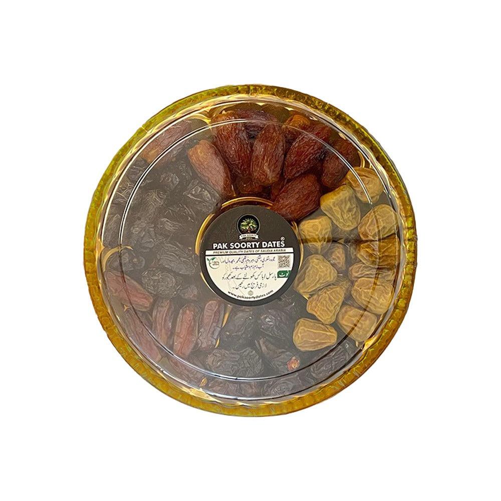 Round transparent container with dried fruits and a label on a white background